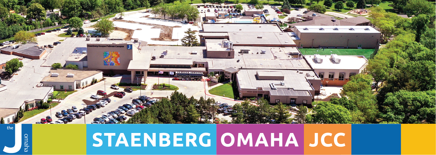 Header image of snow falling in front of the JCC main entrance.