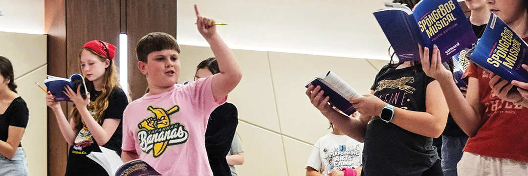 Performing Arts theater students rehearsing Spongebob The Musical with scripts